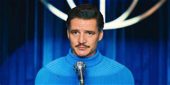 Pedro Pascal holding a microphone